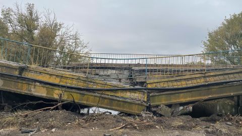 A destroyed bridge is seen near Izium.