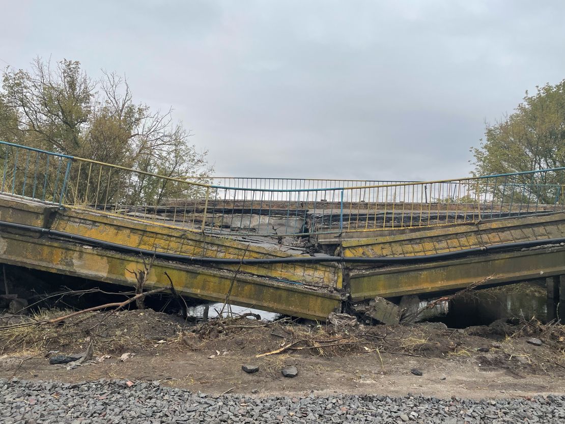 A destroyed bridge is seen near Izium.