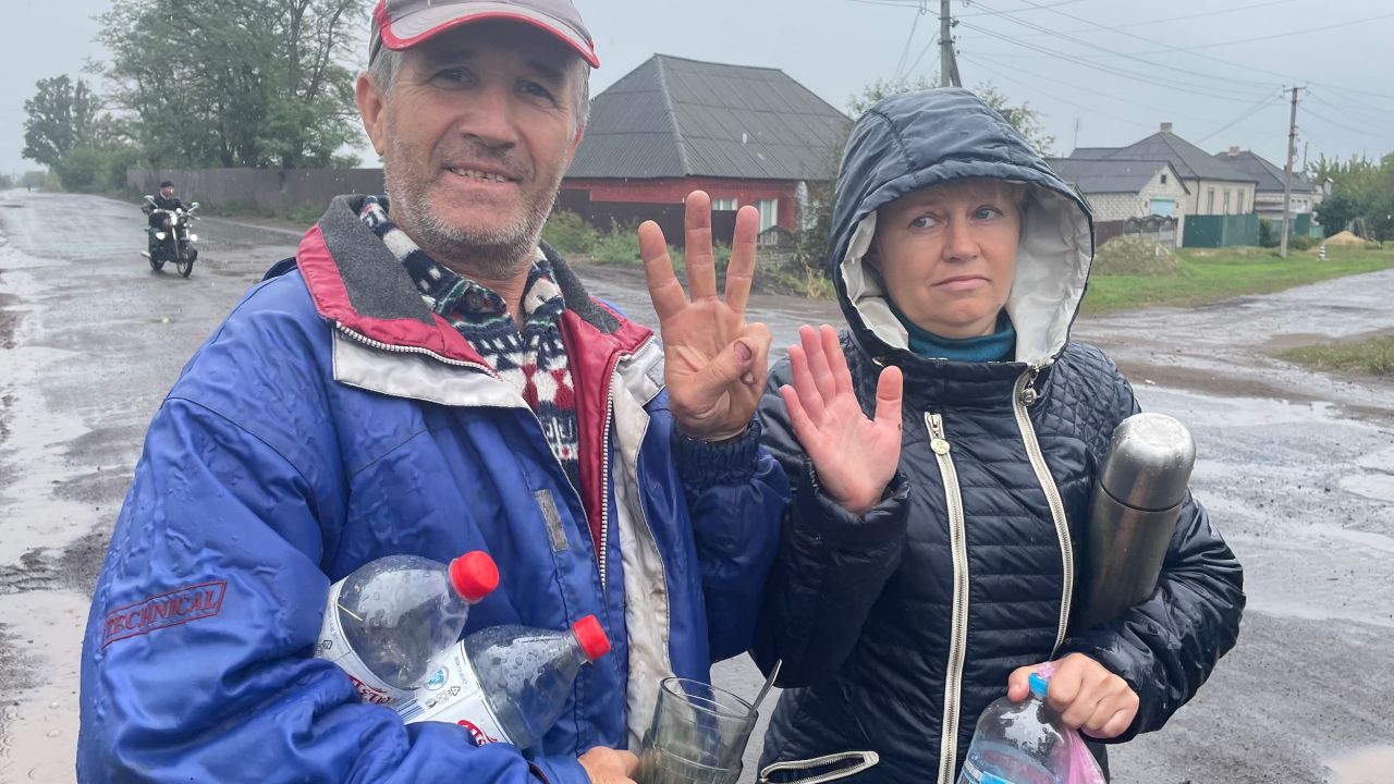 Izium resident Valeriy, pictured with his wife, told CNN that locals were angry with the Russians for their behavior.