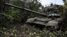 This photograph taken on September 11, 2022, shows an abandoned Russian tank in vegetation in a village on the outskirts of Izyum, Kharkiv Region, eastern Ukraine, amid the Russian invasion of Ukraine. - Ukraine forces said that their lightning counter-offensive took back more ground in the past 24 hours, as Russia replied with strikes on some of the recaptured ground. The territorial shifts were one of Russia's biggest reversals since its forces were turned back from Kyiv in the earliest days of the nearly seven months of fighting, yet Moscow signalled it was no closer to agreeing a negotiated peace. (Photo by Juan BARRETO / AFP) (Photo by JUAN BARRETO/AFP via Getty Images)
