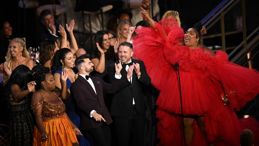 US singer-songwriter Lizzo (R) accepts the award for Outstanding Competition Program for "Lizzo's Watch Out For the Big Grrrls" onstage during the 74th Emmy Awards at the Microsoft Theater in Los Angeles, California, on September 12, 2022. (Photo by Patrick T. FALLON / AFP) (Photo by PATRICK T. FALLON/AFP via Getty Images)