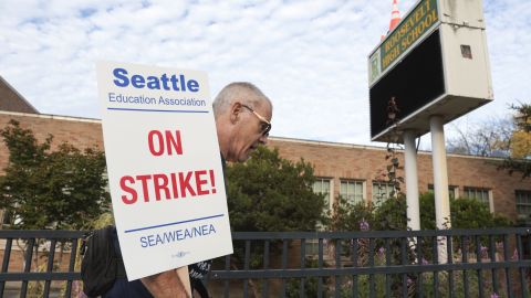 Math teacher Royce Christensen pickets outside Roosevelt High School in Seattle Wednesday.