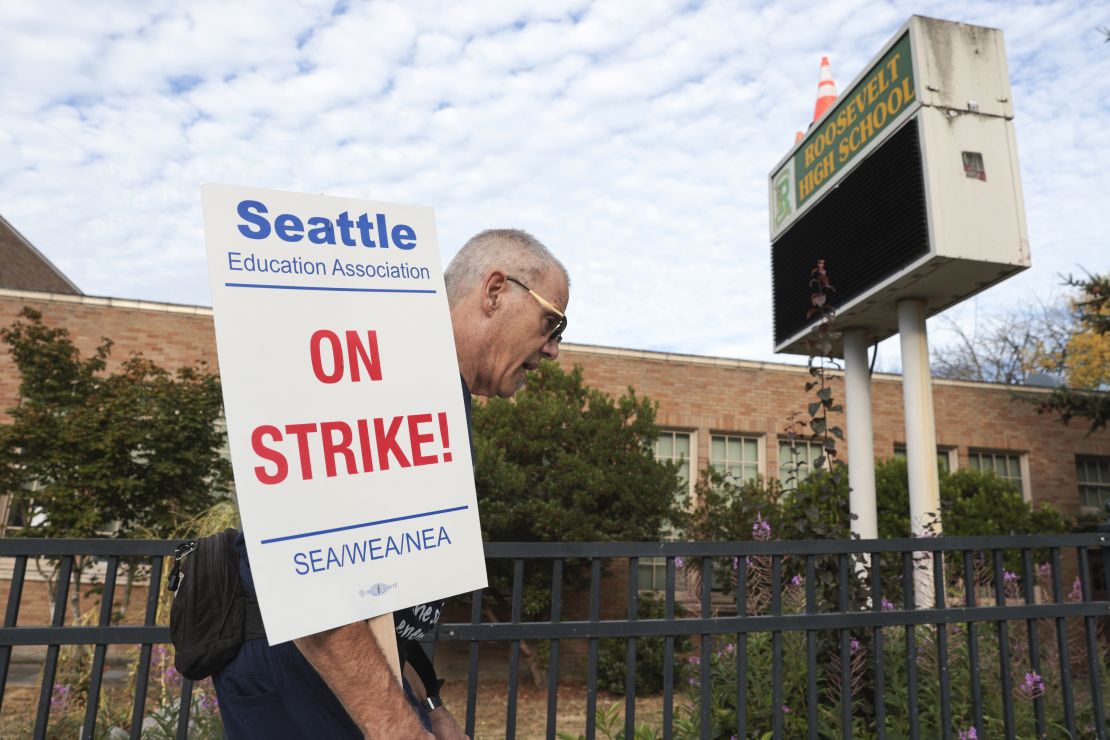Math teacher Royce Christensen pickets outside Roosevelt High School in Seattle Wednesday.