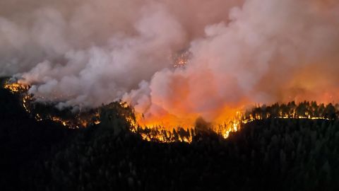 A view shows the Mosquito Fire burning in Foresthill, California, Sunday.