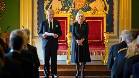 Britain's King Charles III, flanked by Camilla, the Queen Consort, makes a speech after receiving a message of condolence in Northern Ireland.
