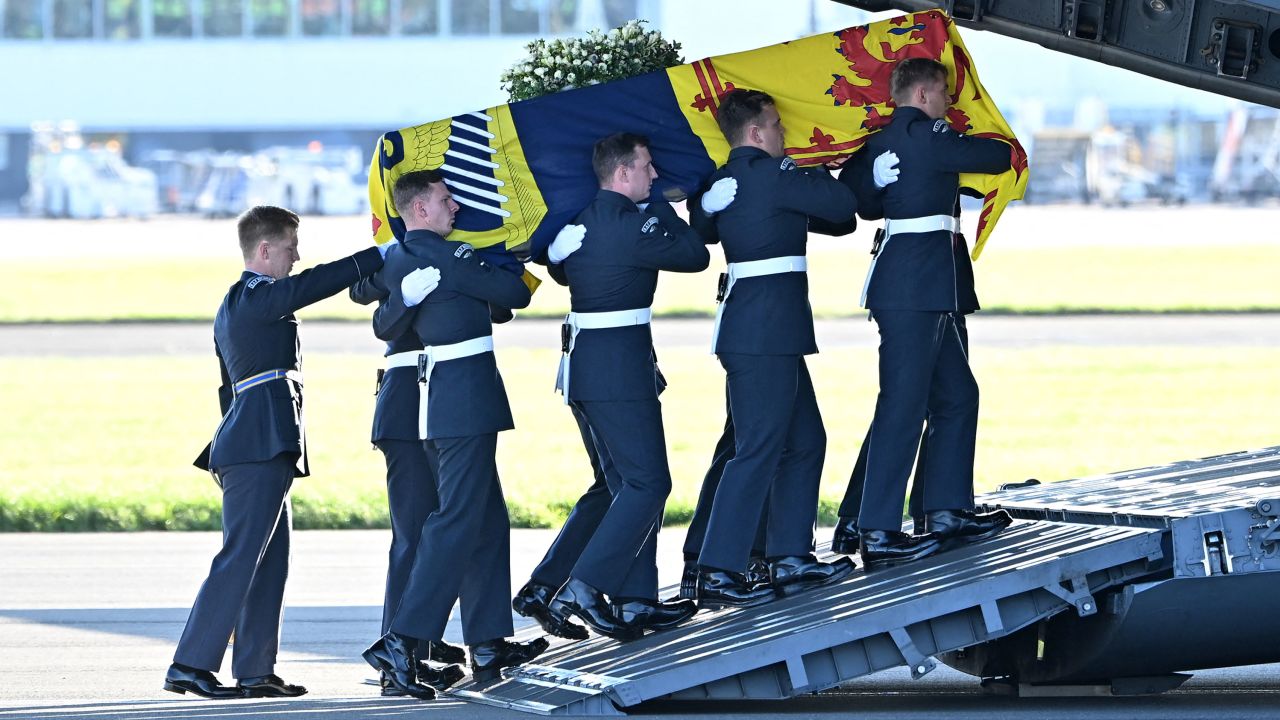 Pallbearers from the Queen's Colour Squadron of the Royal Air Force carry the Queen's coffin, draped in the Royal Standard of Scotland, into a RAF C-17 Globemaster aircraft at Edinburgh airport on September 13.