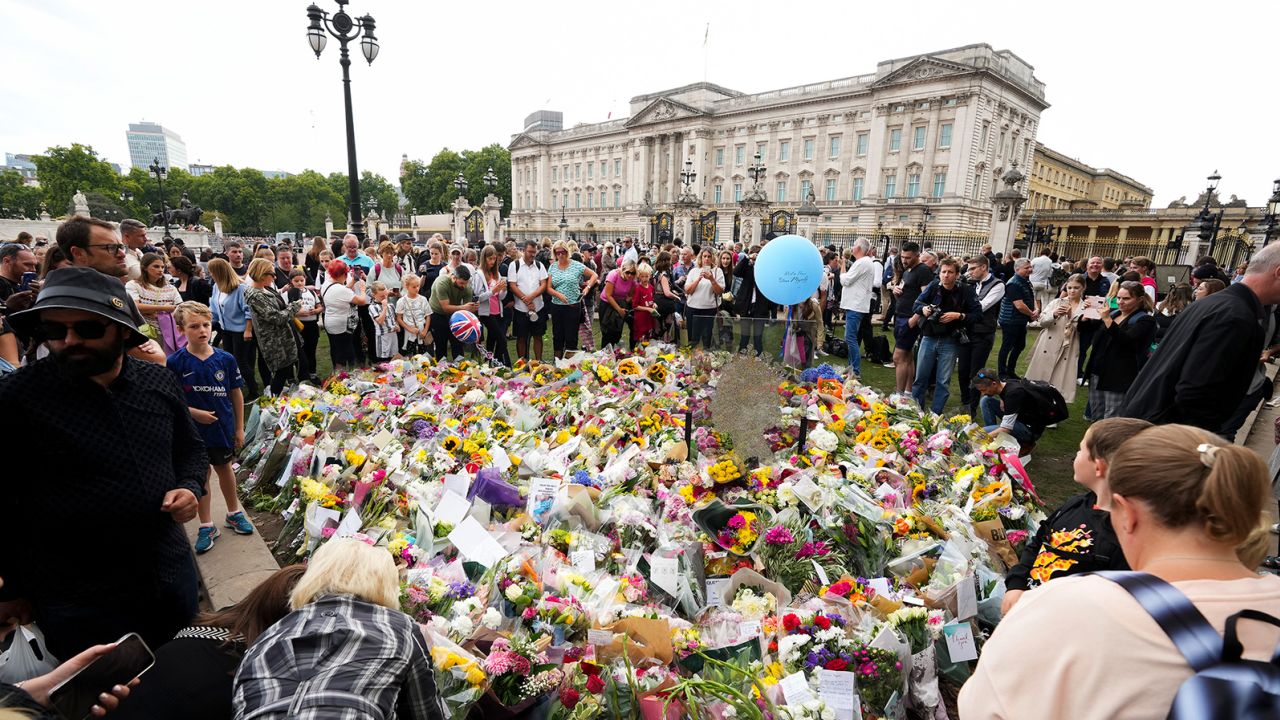 Hundreds of people lay tributes to the Queen outside Buckingham Palace in London, on Saturday, September 10.
