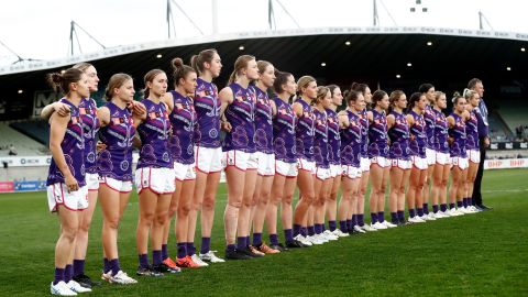 Fremantle Dockers players line up before an AFLW match with the Western Bulldogs in Melbourne on September 9, 2022.