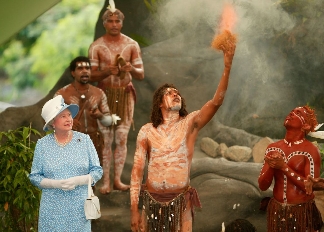 Queen Elizabeth II  watches an Aboriginal cultural performance near Cairns, March 2002.