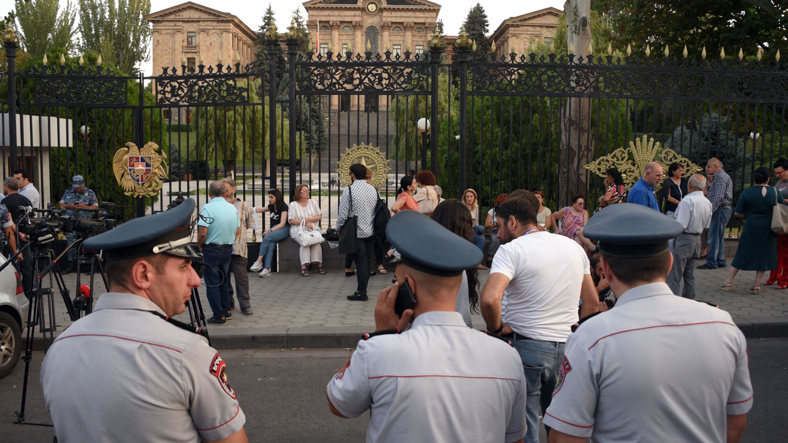 Armenian opposition supporters and relatives of servicemen wounded in border clashes between Armenia and Azerbaijan gather in front of the parliament to call for the Armenian prime minister's resignation, in Yerevan on September 13, 2022.