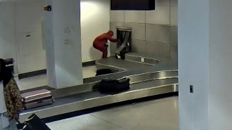 Man arrested after climbing through airport baggage carousel