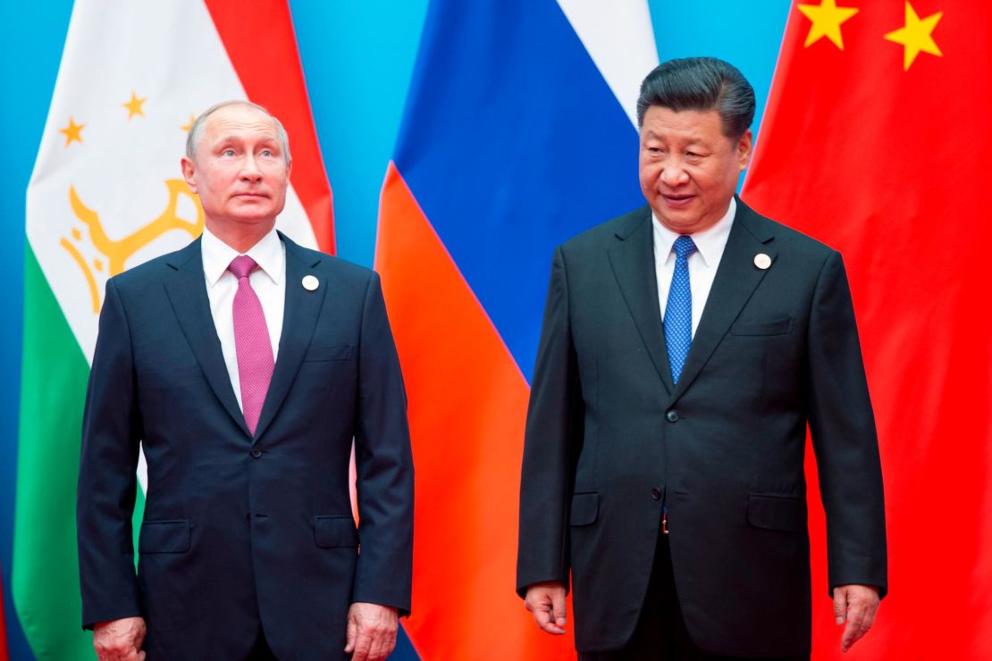 Chinese President Xi Jinping, right, and Russian President Vladimir Putin pose for a photo at the Shanghai Cooperation Organization (SCO) Summit in Qingdao in eastern China's Shandong Province on June 10, 2018.