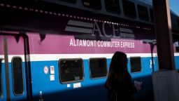 A commuter stands near a San Joaquin Regional Rail Commission Altamont Commuter Express (ACE) train on a platform at the San Jose Diridon train station in San Jose, California, U.S., on Monday, Feb. 26, 2018. Google parent Alphabet Inc., already Silicon Valley's biggest property owner, is negotiating to buy 40 acres of city-owned land for a new campus near San Jose's SAP Center and Diridon train station. Photographer: David Paul Morris/Bloomberg via Getty Images