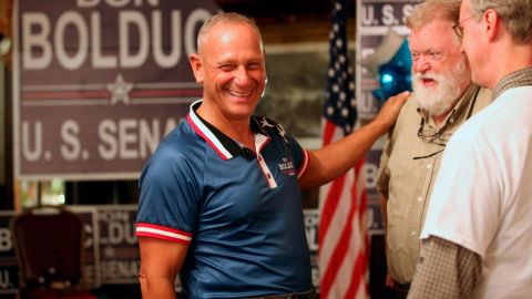 New Hampshire Republican U.S. Senate candidate Don Bolduc chats with supporters during a primary night campaign gathering, Tuesday Sept. 13, 2022, in Hampton, N.H. (AP Photo/Reba Saldanha)