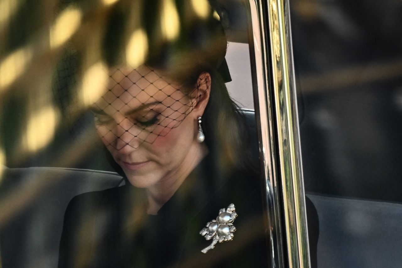 Catherine, the Princess of Wales, is driven behind the Queen's coffin during the procession on Wednesday. She wore a <a href="https://www.cnn.com/uk/live-news/queen-elizabeth-westminster-news-intl/h_4d1112da48746580ca73eaca8e33382a" target="_blank">diamond and pearl leaf brooch</a> that belonged to the Queen, according to the UK's Press Association.