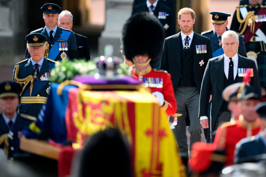 The King and his sons, Prince William and Prince Harry, walk behind the coffin during Wednesday's procession.