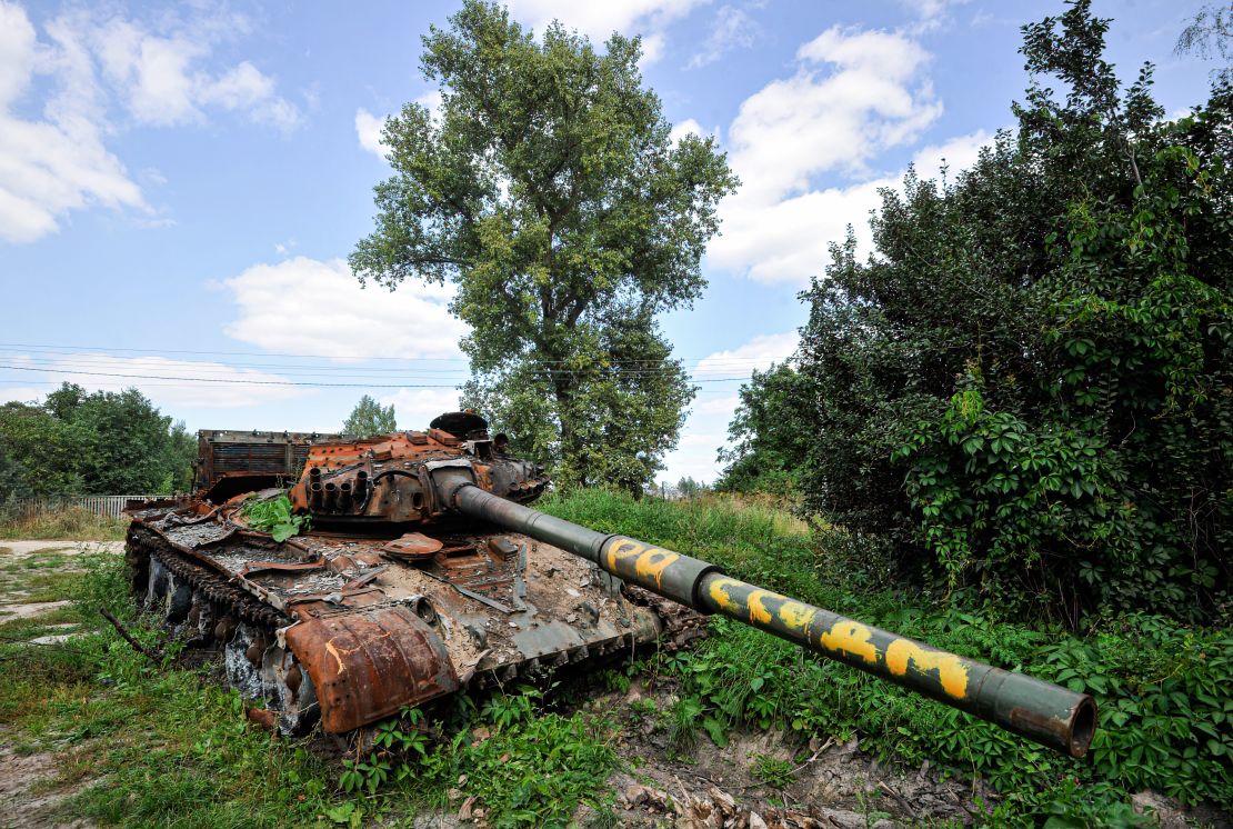 A destroyed Russian tank overgrown by plants in the village of Lukashivka, in the Chernihiv region of Ukraine.