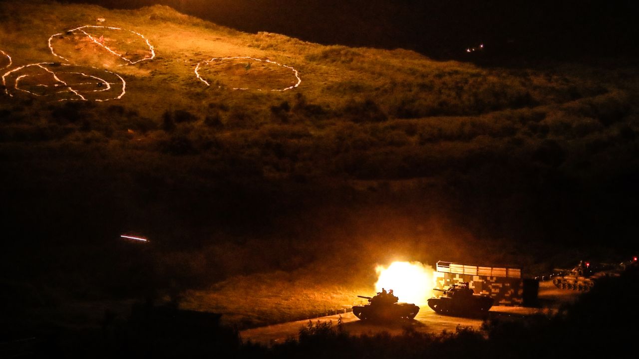 Tanks fire projectiles during a Taiwanese military live-fire drill, after Beijing increased its military exercises near Taiwan in September.