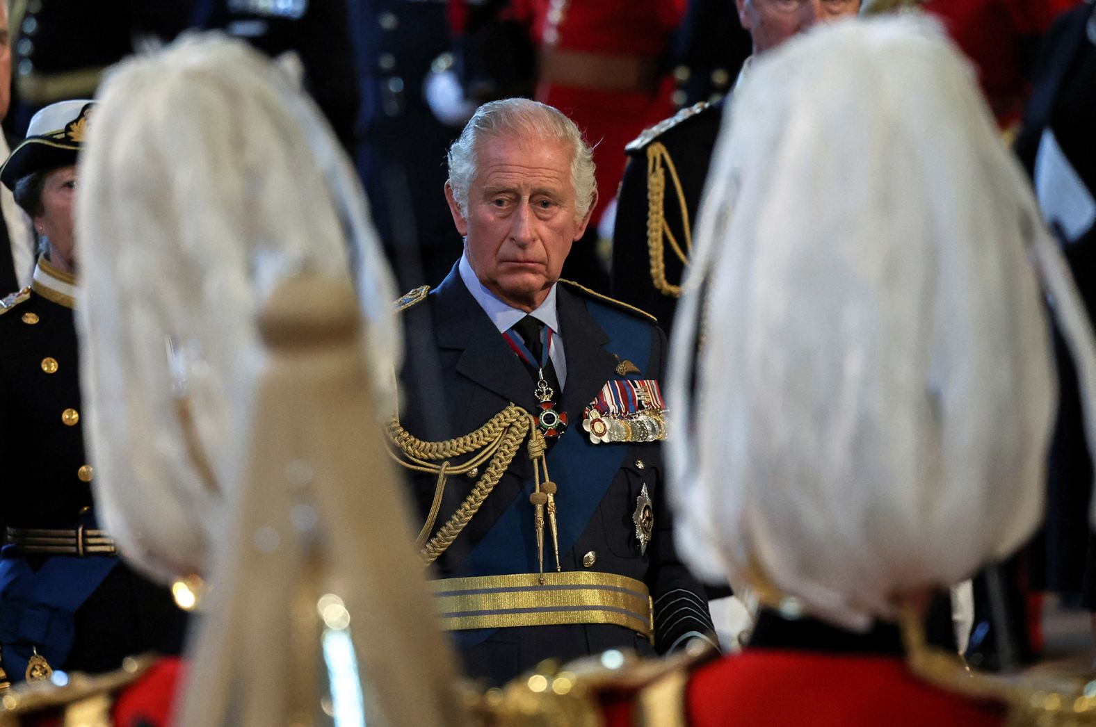 The King watches his mother's coffin arrive at Westminster Hall.