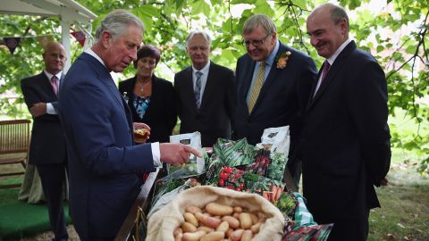 Prince Charles looks at the products at a reception in 2013 to celebrate Duchy Originals' anniversary.