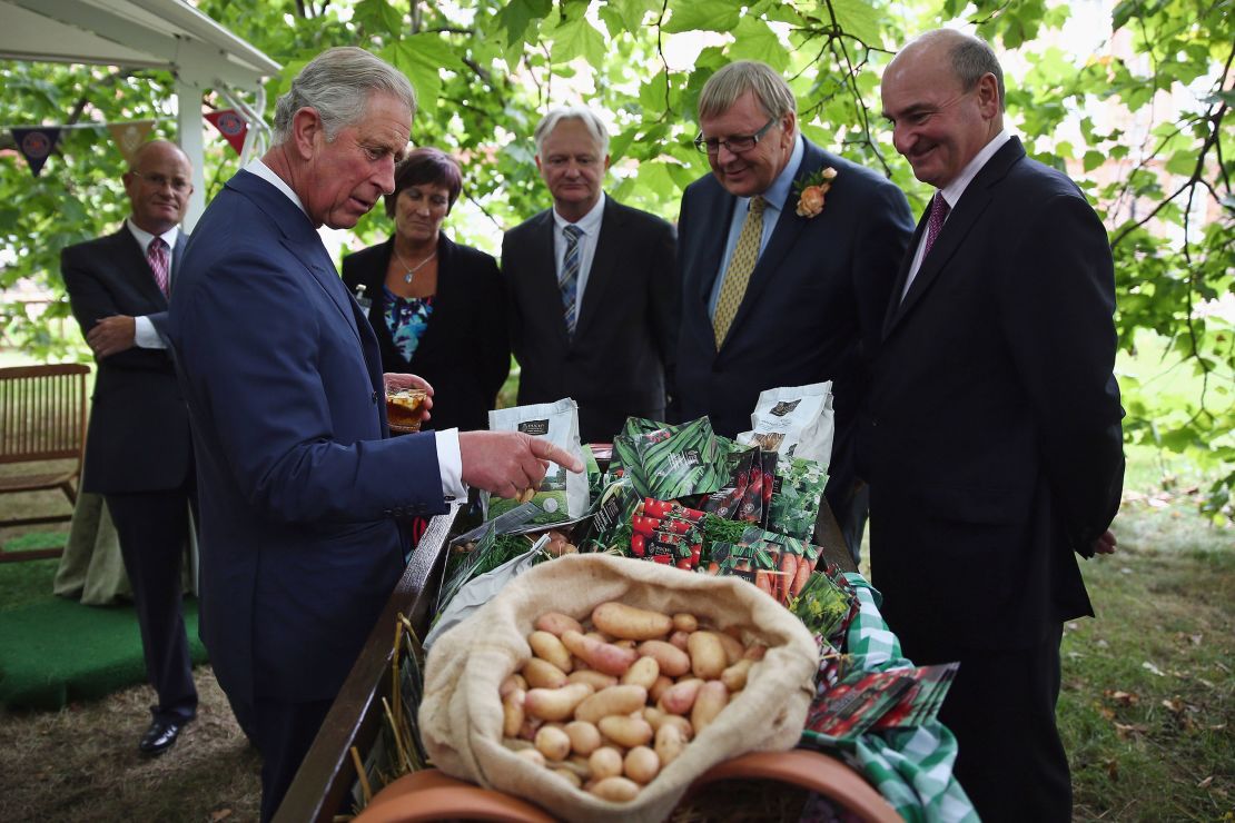 Prince Charles looks at produce during a reception in 2013 to celebrate the anniversary of Duchy Originals.