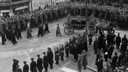 February 1952:  King George VI's funeral procession nears Paddington Station in London, where it will board a train to Windsor.  (Photo by Evening Standard/Getty Images)