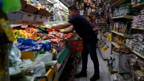 A person arranges groceries in El Progreso Market in the Mount Pleasant neighborhood of Washington, D.C., U.S., August 19, 2022. 