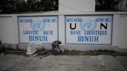 A man checks a paint bucket as he paints a sign at the Logistic Base of the BINUH (United Nations Integrated Office in Haiti) in Port-au-Prince, Haiti, October 30, 2019. REUTERS/Andres Martinez Casares