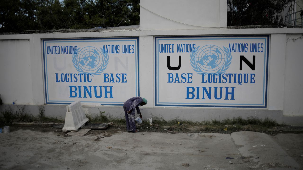 A man paints a sign at the Logistic Base of the BINUH (United Nations Integrated Office in Haiti) in Port-au-Prince, Haiti, October 30, 2019. 