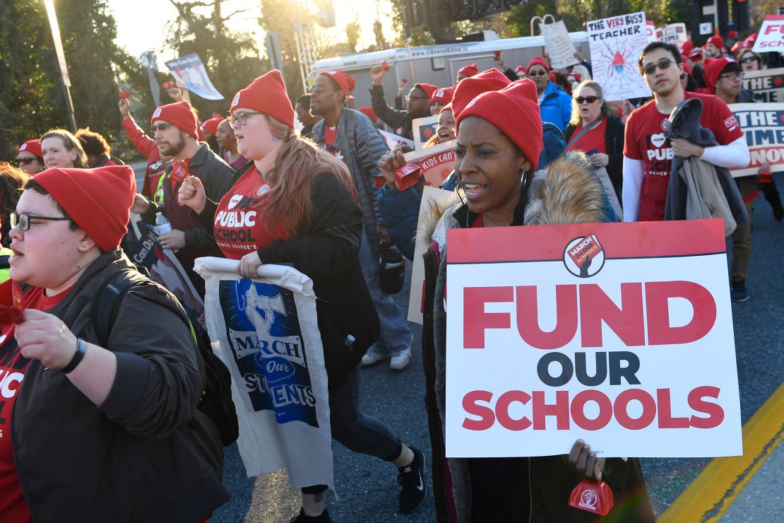 Teachers and supporters rally in 2019 in Annapolis, Maryland. Baltimore union members asked for fans to be donated to cool sweltering classrooms without air-conditioning.