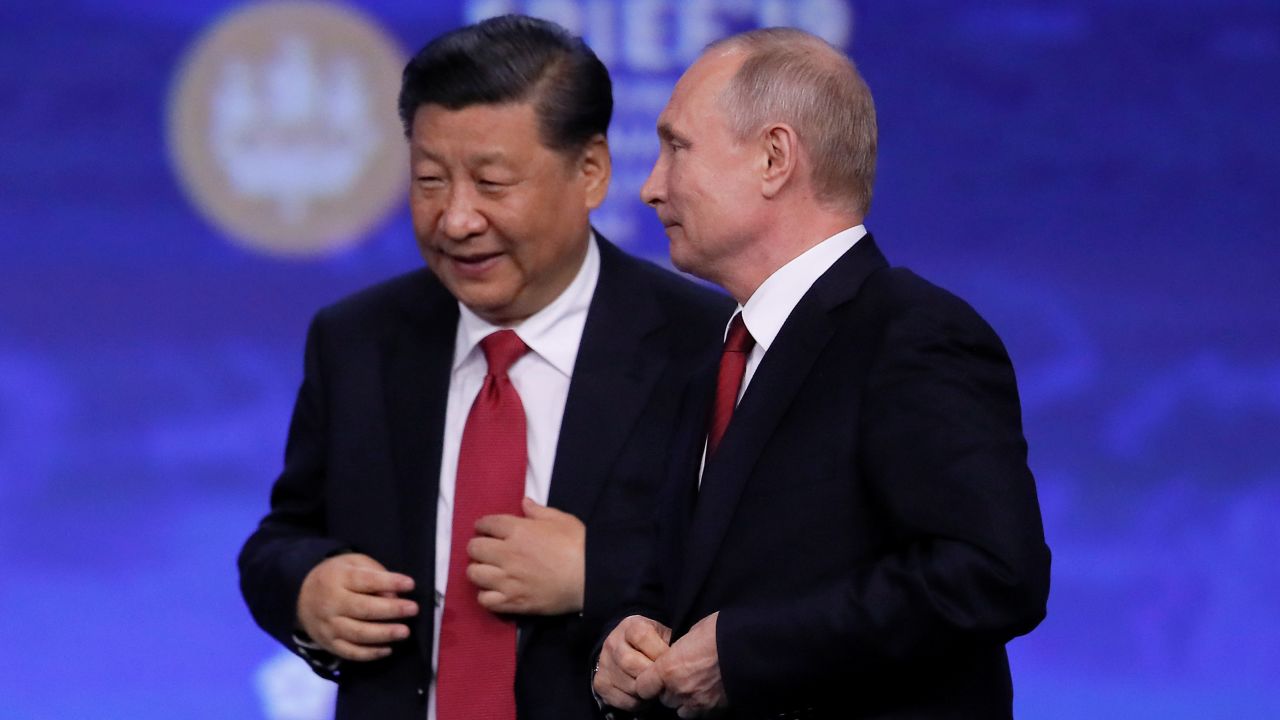 Chinese President Xi Jinping and Russian President Vladimir Putin appear after a session of the St. Petersburg International Economic Forum.