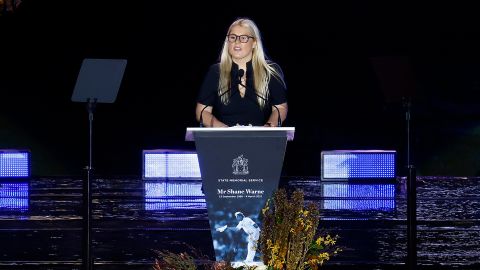 Brooke Warne speaks on stage during the state memorial service for her father, Shane Warne, at the Melbourne Cricket Ground on March 30, 2022 in Melbourne, Australia.