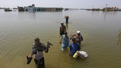 Residents in Sindh Province, Pakistan salvaging belongings from their homes in the aftermath of floods triggered by heavy monsoonal rains, on September 9, 2022.