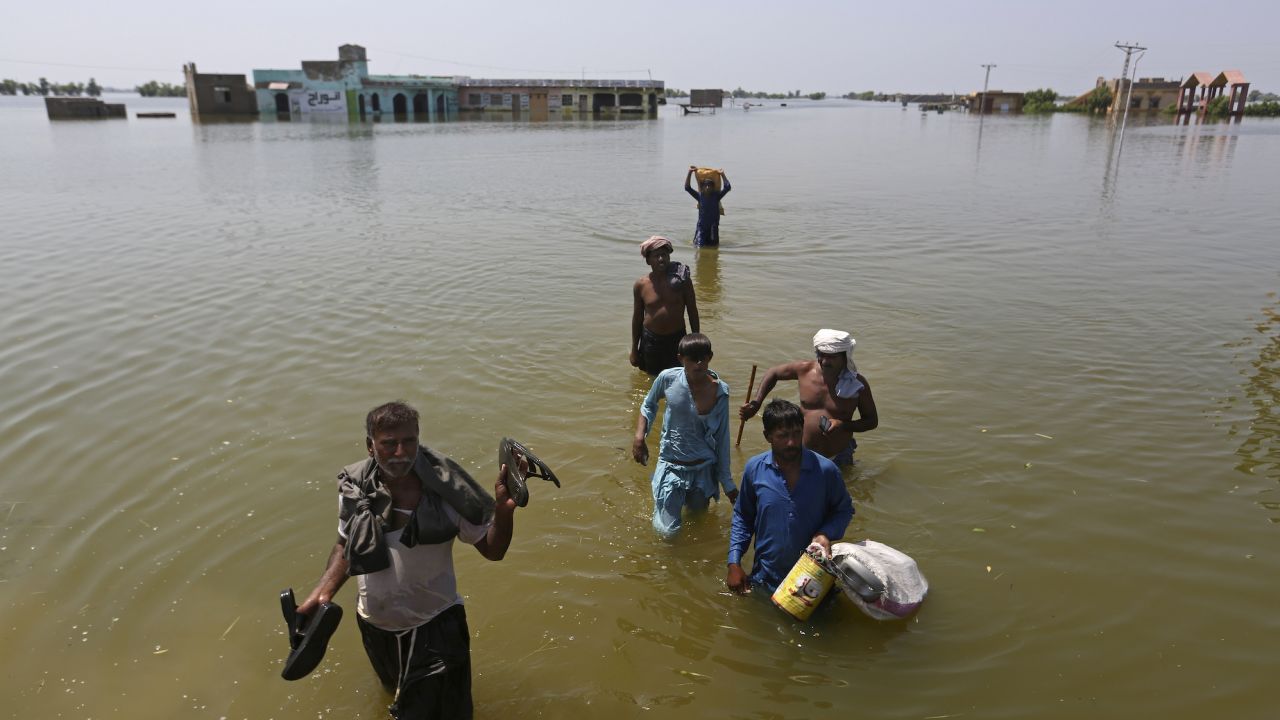 Residents in Sindh Province, Pakistan salvaging belongings from their homes in the aftermath of floods triggered by heavy monsoonal rains, on September 9, 2022.