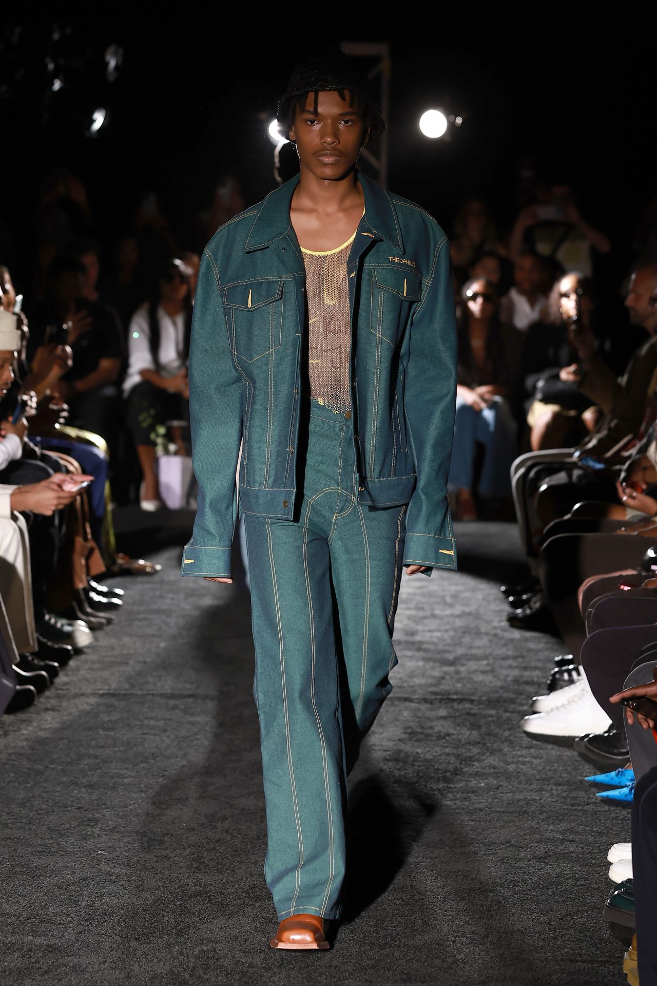 The streetwear-to-evening looks featured denim, snakeskin, leather, mesh, and lace.