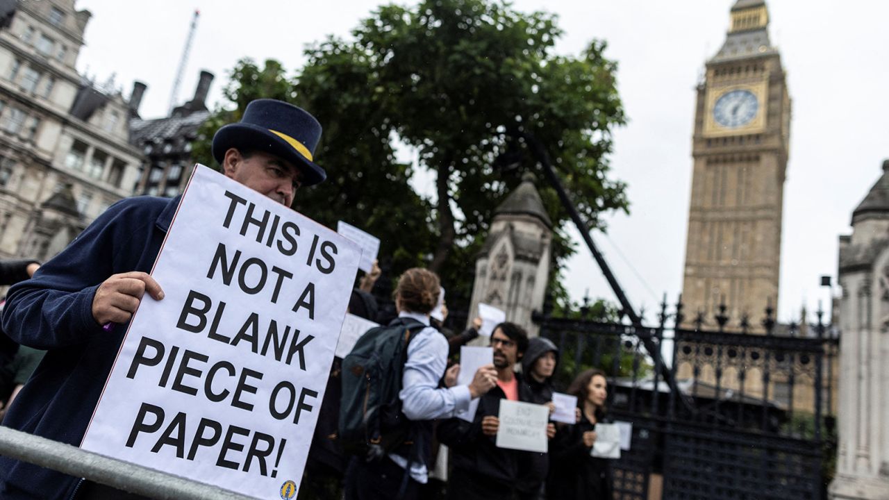 Protesters gathered outside the Houses of Parliament on Tuesday, many carrying blank signs.