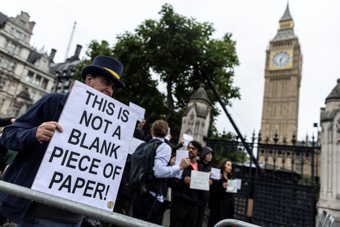Protesters gathered outside the Houses of Parliament on Tuesday, many carrying blank signs.