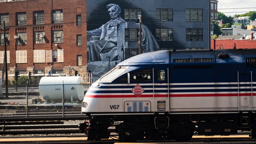 A train is seen near a mural of Abraham Lincoln is seen in the Eckington neighborhood of Washington, D.C., on Monday, August 22, 2022.