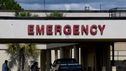 BROOKSVILLE, FLORIDA, UNITED STATES - 2020/07/26: People are seen outside the entrance to the emergency room at Oak Hill Hospital in Hernando County, one of 23 counties in the state of Florida that has no available adult ICU beds. Hospitals in Florida are struggling to keep up with the increasing numbers of COVID-19 patients in a state that has recorded over 423,000 coronavirus cases, second only to California. (Photo by Paul Hennessy/SOPA Images/LightRocket via Getty Images)