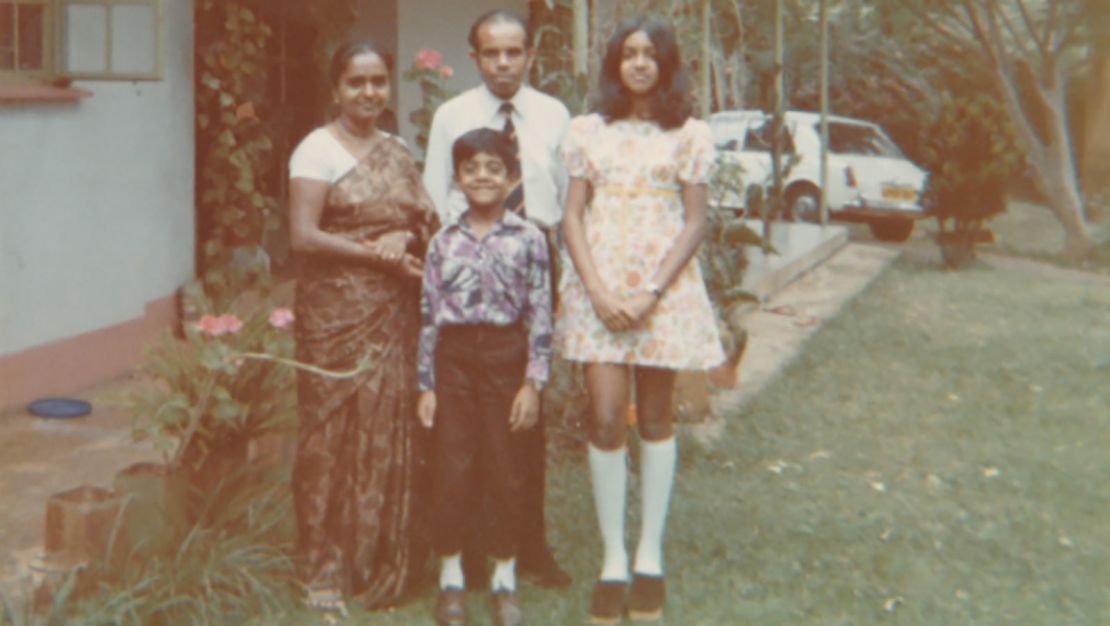 The writer's grandparents Rachel and Philip with two of their children outside their home in Kampala in 1972, shortly before leaving for the UK.