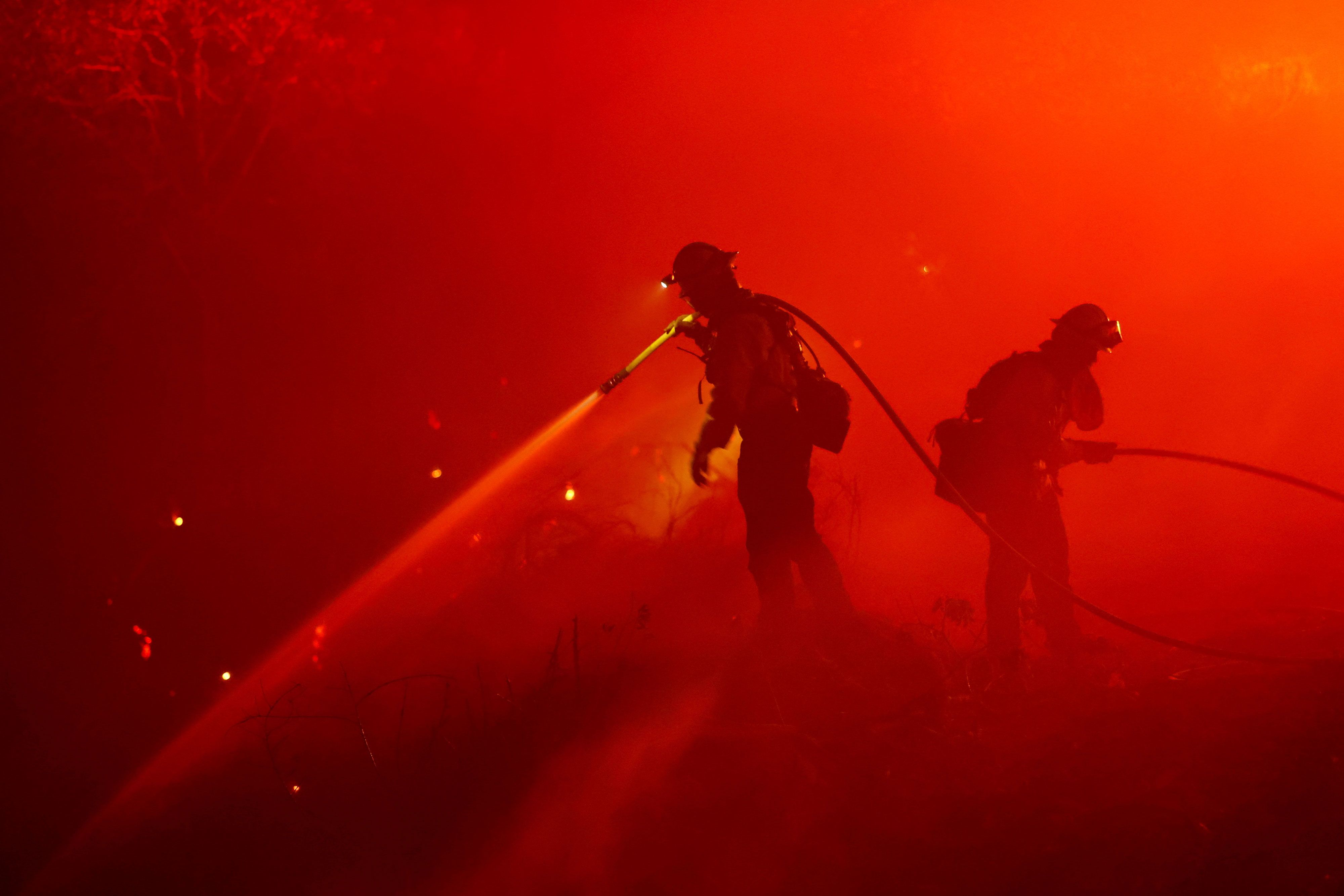 Firefighters work in Foresthill, California, on Tuesday, September 13. The Mosquito Fire is now California's biggest wildfire this year.