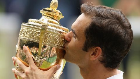 LONDON, ENGLAND - JULY 16:  Roger Federer of Switzerland kisses the trophy as he celebrates victory after the Gentlemen's Singles final against Marin Cilic of Croatia on day thirteen of the Wimbledon Lawn Tennis Championships at the All England Lawn Tennis and Croquet Club at Wimbledon on July 16, 2017 in London, England. (Photo by Julian Finney/Getty Images)