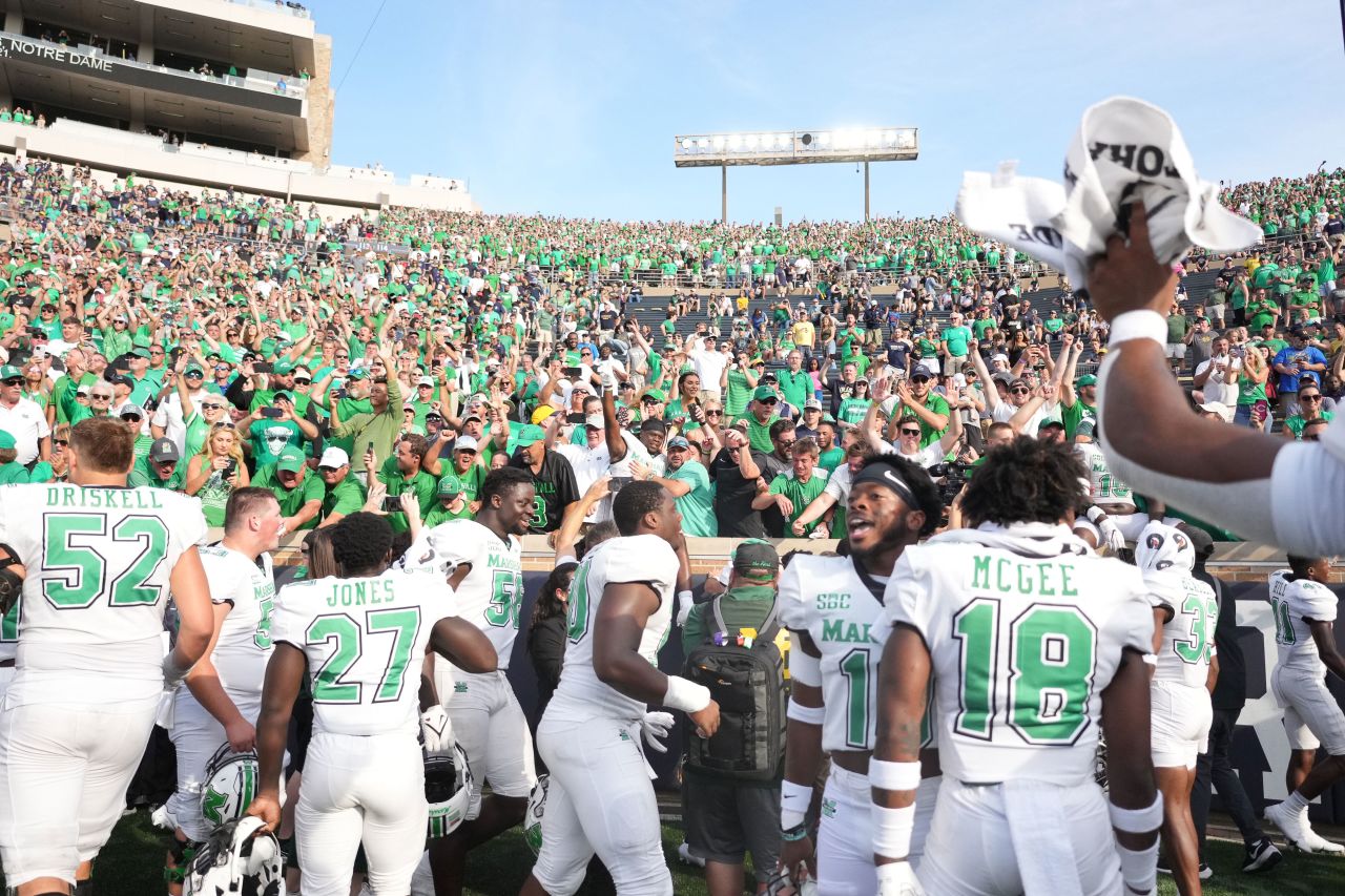 Marshall football players celebrate with fans after upsetting No. 8 Notre Dame 26-21 on Saturday, September 10. Marshall was one of three Sun Belt Conference teams that knocked off heavily favored teams in power conferences. Appalachian State defeated No. 6 Texas A&M 17-14, and Georgia Southern topped Nebraska 45-42.