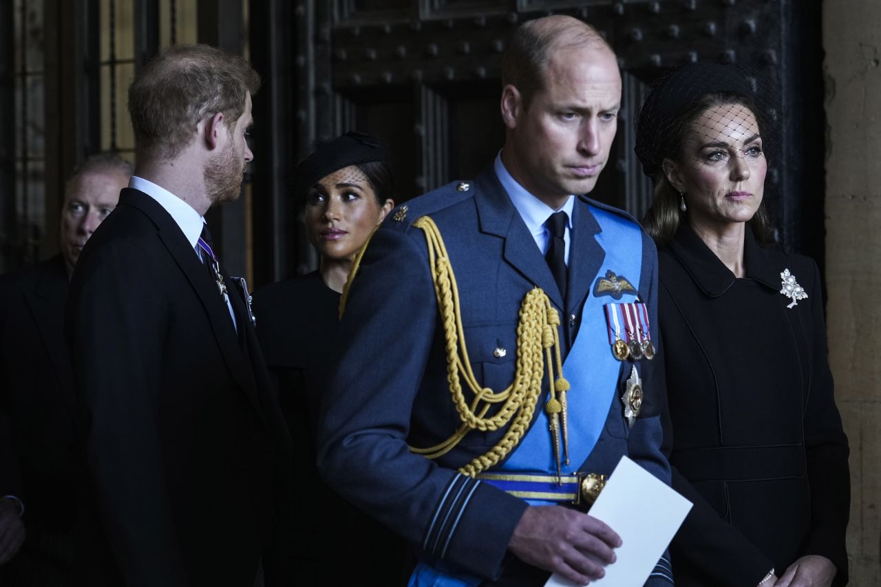 Britain's Prince Harry and Meghan, the Duchess of Sussex, walk behind Prince William and Catherine, the Princess of Wales, as they leave Westminster Hall in London on Wednesday, September 14. <a href="https://www.cnn.com/2022/09/08/uk/gallery/britain-mourns-queen-elizabeth-ii/index.html" target="_blank">The Queen's coffin is lying in state</a> at Westminster Hall before her state funeral on Monday.