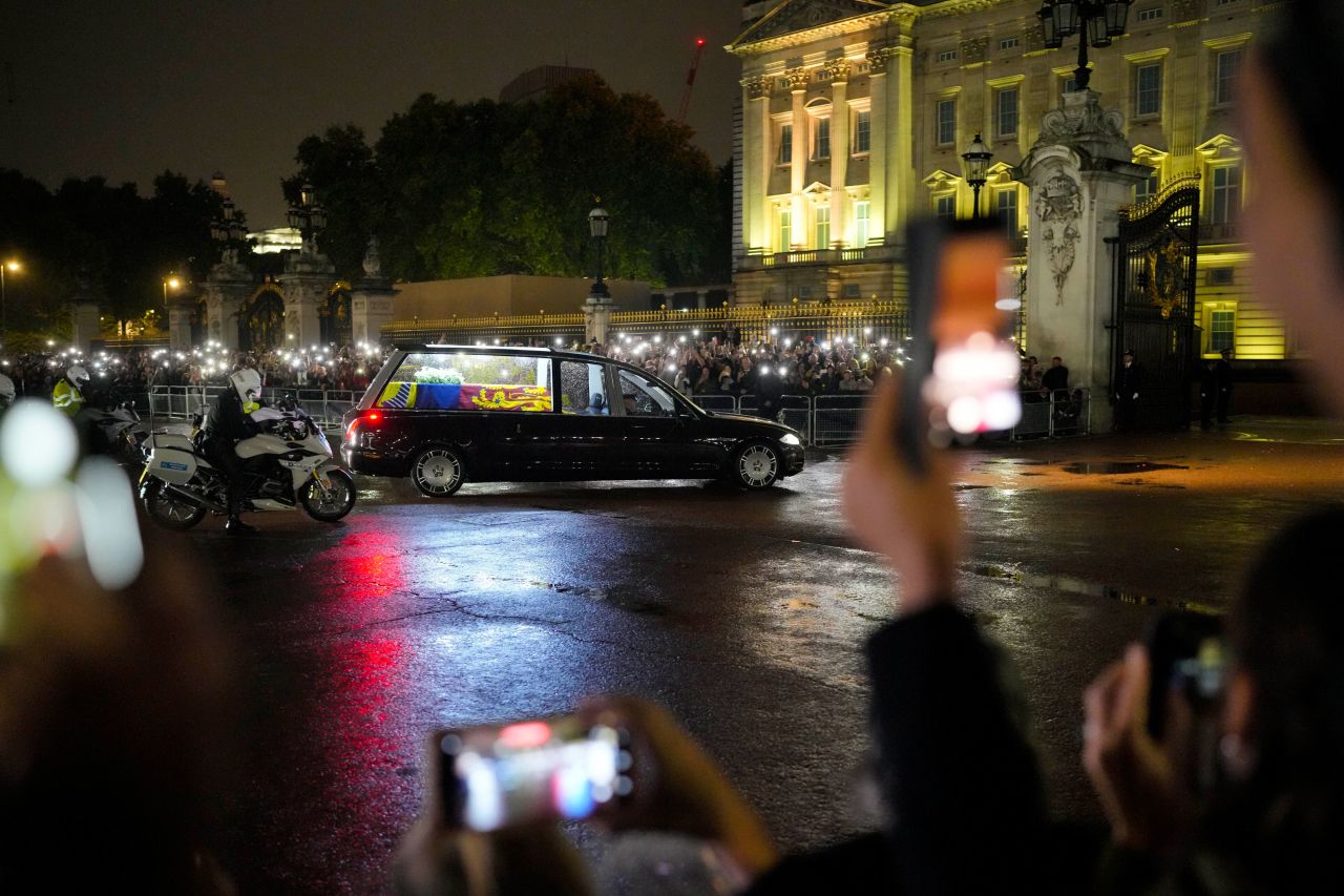 A hearse carrying the coffin of Britain's Queen Elizabeth II arrives at Buckingham Palace in London on Tuesday, September 13.