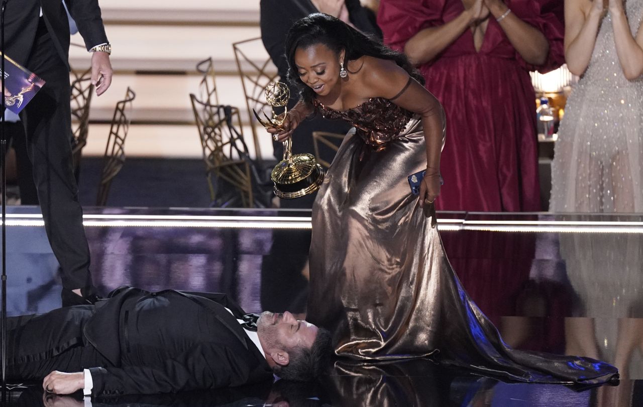 Actress Quinta Brunson checks on talk-show host Jimmy Kimmel, who was lying on the ground as part of a comedy bit at the <a href=