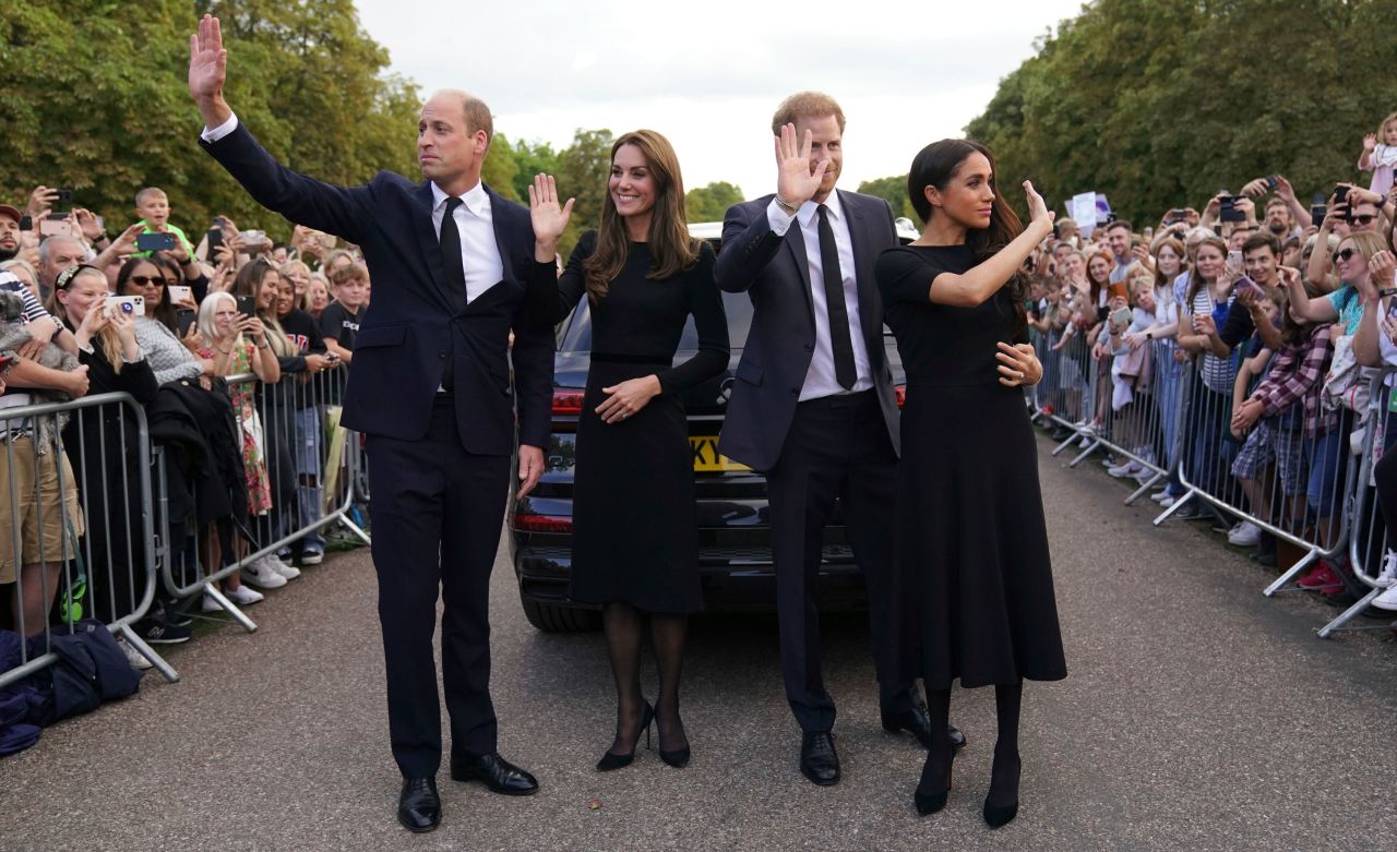 Britain's Prince William, left, is joined by his wife Catherine, the Princess of Wales; his brother, Prince Harry; and his sister-in-law Meghan, the Duchess of Sussex, outside Windsor Castle on Saturday, September 10. 
