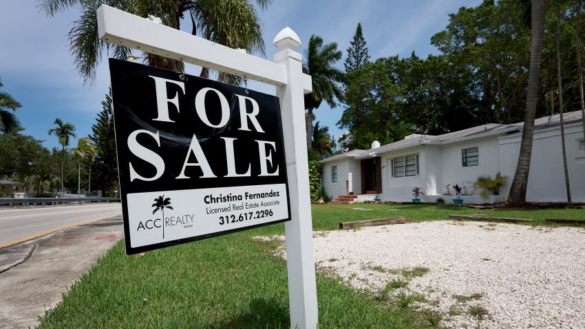 MIAMI, FLORIDA - JUNE 21: A 'for sale' sign hangs in front of a home on June 21, 2022 in Miami, Florida. (Photo by Joe Raedle/Getty Images)