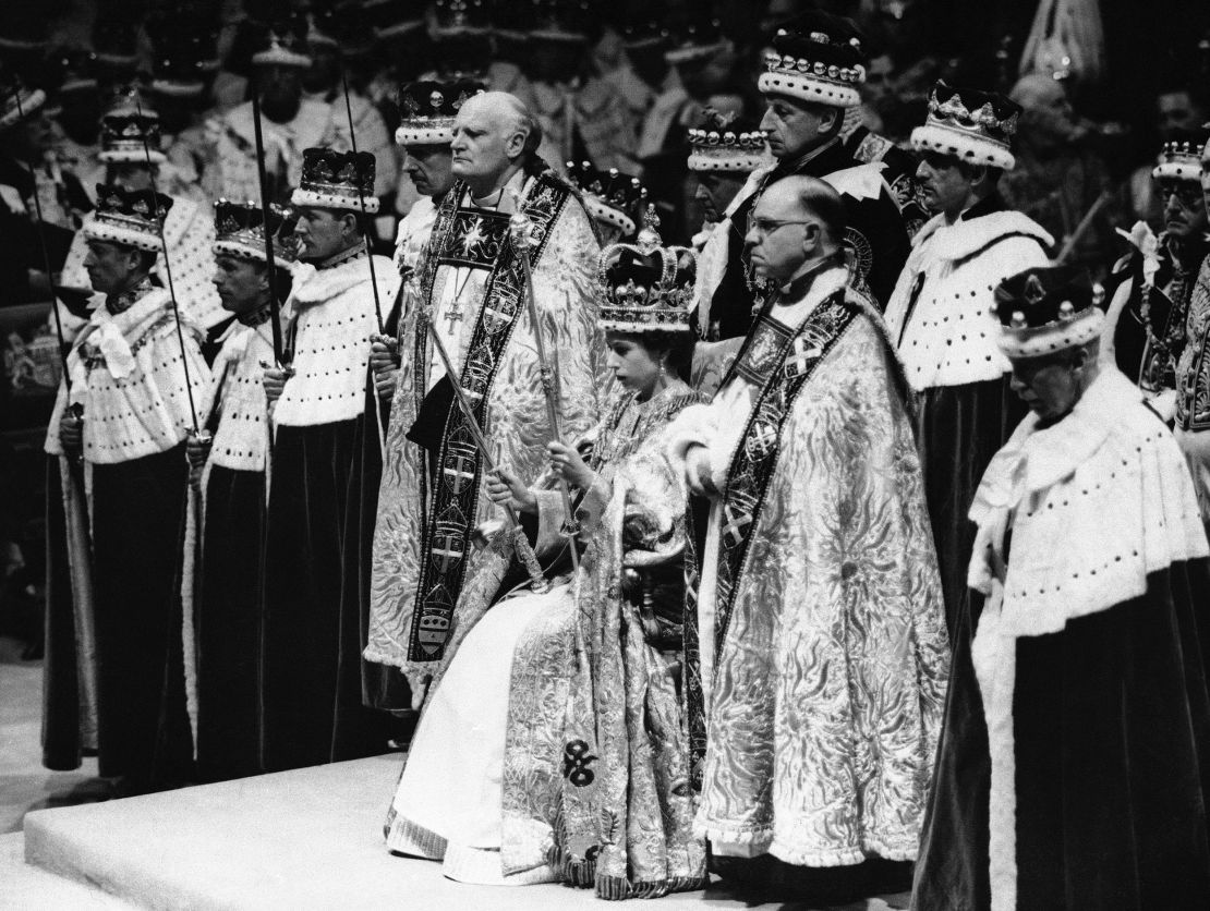 In this June 2, 1953 file photo, Britain's Queen Elizabeth II sits on a throne, during her coronation, in London. 