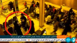 A video, released by Iranian state TV, shows the alleged moment that 22 year-old Mahsa Amini, facing the camera in the red circle, collapses after being arrested by Iran's "morality police."